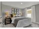 Cozy bedroom featuring soft lighting, six framed prints, and a plush upholstered bed for ultimate relaxation at 16966 Sandhurst Pl, Westfield, IN 46074