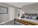 Serene bedroom featuring soft gray walls, tractor-themed decor, and an open doorway leading to another room at 16966 Sandhurst Pl, Westfield, IN 46074