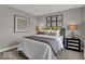 Elegant bedroom featuring mirrored nightstands, soft lighting, and decorative artwork for a luxurious retreat at 16966 Sandhurst Pl, Westfield, IN 46074