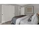 Comfortable bedroom with sliding closet doors, neutral gray tones, and cozy bedding for a restful atmosphere at 16966 Sandhurst Pl, Westfield, IN 46074