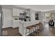 Inviting kitchen featuring a large island with seating, stainless appliances, and contemporary design at 16966 Sandhurst Pl, Westfield, IN 46074