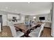 Open living area adjacent to modern kitchen and breakfast bar at 16966 Sandhurst Pl, Westfield, IN 46074