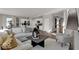 Open concept living room featuring neutral color palette and hardwood floors throughout the main level at 16966 Sandhurst Pl, Westfield, IN 46074