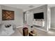 Comfortable living room featuring contemporary decor, unique art and ample space for relaxation at 16966 Sandhurst Pl, Westfield, IN 46074