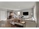 Bright living room featuring neutral color palette and hardwood floors that flow through the kitchen at 16966 Sandhurst Pl, Westfield, IN 46074