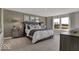 Inviting main bedroom featuring plush bedding, elegant lamps and a large window overlooking serene landscape at 16966 Sandhurst Pl, Westfield, IN 46074