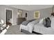 Comfortable main bedroom featuring an ensuite bathroom, dresser, mirror, and lots of natural light at 16966 Sandhurst Pl, Westfield, IN 46074