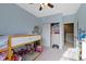 Cozy room features a loft bed and closet with ample storage at 2231 Colfax Ln, Indianapolis, IN 46260