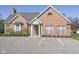 A brick building with manicured landscaping is well-maintained and inviting at 2231 Colfax Ln, Indianapolis, IN 46260