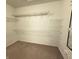 Walk-in closet featuring white wire shelving and neutral carpeting at 2231 Colfax Ln, Indianapolis, IN 46260