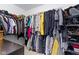 Well-organized walk-in closet with hanging racks and shelves for ample storage at 2231 Colfax Ln, Indianapolis, IN 46260
