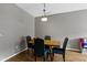 Kitchen with breakfast bar and stools, next to dining area and stairs at 2231 Colfax Ln, Indianapolis, IN 46260