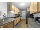 Bright kitchen features light wood cabinetry, modern appliances, and durable countertops at 2231 Colfax Ln, Indianapolis, IN 46260