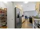 Spacious kitchen with stainless steel refrigerator and adjacent dining area at 2231 Colfax Ln, Indianapolis, IN 46260