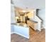 Well-lit kitchen features stainless steel appliances, updated cabinets, and a breakfast bar at 2231 Colfax Ln, Indianapolis, IN 46260