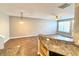 Bright living area features hardwood floors, recessed lights, and neutral walls at 2231 Colfax Ln, Indianapolis, IN 46260
