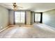 Expansive living room featuring two large windows and neutral carpeting at 2231 Colfax Ln, Indianapolis, IN 46260