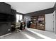 Spacious primary bedroom with modern dark walls, large windows, ceiling fan, and built-in shelving at 2231 Colfax Ln, Indianapolis, IN 46260
