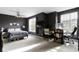 Spacious primary bedroom with modern dark walls, large windows, ceiling fan, and a dedicated office space at 2231 Colfax Ln, Indianapolis, IN 46260
