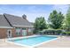 Community pool with lounge chairs and landscaping is a relaxing place to spend the day at 2231 Colfax Ln, Indianapolis, IN 46260
