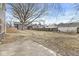 Wide view of the backyard, showing the detached garage and a tree at 2421 E 11Th St, Indianapolis, IN 46201