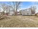 Backyard view showing the two-story addition and detached two-car garage at 2421 E 11Th St, Indianapolis, IN 46201