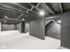 Finished basement painted light gray with block walls, exposed ceiling, and recessed lighting at 2421 E 11Th St, Indianapolis, IN 46201