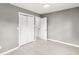 Bedroom with gray walls, wood-look floors, and bi-fold closet at 2421 E 11Th St, Indianapolis, IN 46201