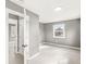 Bedroom with gray walls, wood-look floors, and bright window at 2421 E 11Th St, Indianapolis, IN 46201