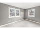 Well-lit bedroom with large windows, neutral colors, and updated flooring at 2421 E 11Th St, Indianapolis, IN 46201