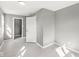 Bedroom with gray walls and flooring, door open to hallway at 2421 E 11Th St, Indianapolis, IN 46201
