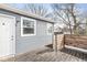 Home exterior with gray siding, wood deck, and walkout at 2421 E 11Th St, Indianapolis, IN 46201