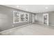 Bright living room featuring large windows, light floors and modern trim at 2421 E 11Th St, Indianapolis, IN 46201