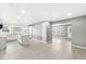 Open-concept living space with sleek floors, neutral walls, and seamless transition to the kitchen area at 2421 E 11Th St, Indianapolis, IN 46201
