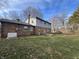 A spacious backyard features a well-kept lawn, mature trees, and a patio for outdoor enjoyment at 2559 Pleasant W Way, Carmel, IN 46280