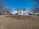 Spacious backyard with large grassy area and a two-story house at 3143 Shadow Lake Dr, Indianapolis, IN 46217