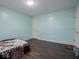 Simple bedroom with wood floors and a closet at 3143 Shadow Lake Dr, Indianapolis, IN 46217
