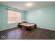 Bedroom with light teal walls and wood flooring at 3143 Shadow Lake Dr, Indianapolis, IN 46217