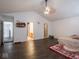 Large bedroom with hardwood floors, ceiling fan, and access to bath at 3143 Shadow Lake Dr, Indianapolis, IN 46217