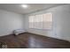 Bright bedroom with dark wood floors and a window at 3143 Shadow Lake Dr, Indianapolis, IN 46217