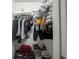 Small closet with clothes and a box on the floor at 3143 Shadow Lake Dr, Indianapolis, IN 46217