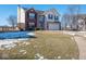 Two-story brick home with attached garage, and a neatly landscaped front yard at 3143 Shadow Lake Dr, Indianapolis, IN 46217