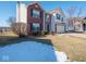 Two-story house with brick and siding exterior, a large front yard, and a driveway at 3143 Shadow Lake Dr, Indianapolis, IN 46217