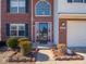 Inviting front door with a red frame and black security door at 3143 Shadow Lake Dr, Indianapolis, IN 46217