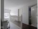 Upstairs hallway with hardwood floors and access to bedrooms at 3143 Shadow Lake Dr, Indianapolis, IN 46217