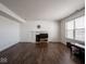 Simple living room with dark hardwood floors and a fireplace at 3143 Shadow Lake Dr, Indianapolis, IN 46217