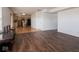 Open living room with dark hardwood floors and kitchen view at 3143 Shadow Lake Dr, Indianapolis, IN 46217