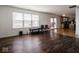 Living room with hardwood floors and view of kitchen and patio at 3143 Shadow Lake Dr, Indianapolis, IN 46217