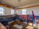 Small outbuilding with kitchen area, shelves and a gas stove at 3143 Shadow Lake Dr, Indianapolis, IN 46217