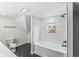Bathroom with hexagon tile floor, a soaking tub and a shower at 350 E Minnesota St, Indianapolis, IN 46225